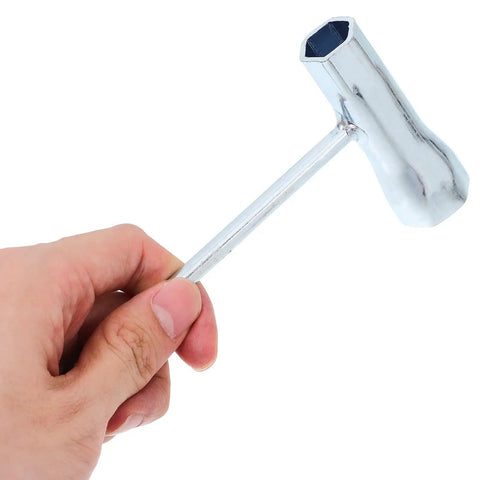 Three Piece Carbon Steel Spark Plug Wrench With Slick Ergonomic Handles For Mechanics And Diy Guys Looking For A Badass Double Ended Socket Kit That Handles Grease Work Without Any Sweat - close-up of wrench in hand.