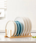 Top Shelf Bamboo Dish Drying Rack Stand Multi Purpose Plate Drainer For Kitchen Counter with various plates organized upright.