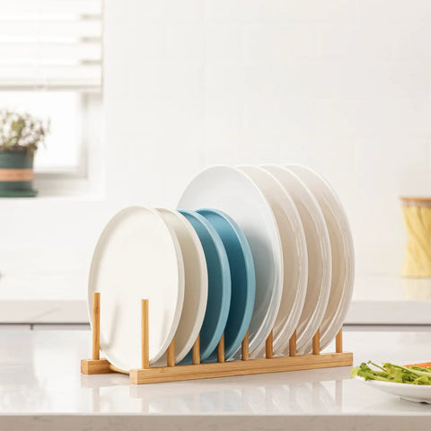 Top Shelf Bamboo Dish Drying Rack Stand Multi Purpose Plate Drainer For Kitchen Counter with various plates organized upright.