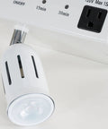 Close-up of Cabinet Light And Power Kit With 3 Prong Outlet And LED Spotlight Auto Off Timer White, showing outlet and spotlight.