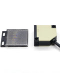 EK50-R4A2 Photoelectric Sensor Indoor Motion Light With Dark No Reflex Material High Sensitivity Motion Detection For Home And Office Energy Saving Auto On Off Easy Install Quiet Reliable Lighting Control, front view with sensor and reflector