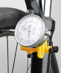 Close-up of Bike Wheel Truing Stand With Percentage Gauge For 26 Inch To 29 Inch Wheels Portable Home Repair Stand with yellow base.