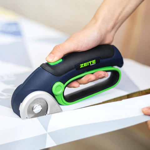 Zeite 4 V Cordless Electric Scissors Cardboard Cutter cutting fabric with easy grip handle and rotating blade.