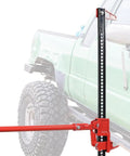 48 Inch Ratcheting Off Road Utility Jack With 7000 Lb Capacity For Tractors And Trucks lifting a green truck