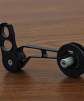 Rear Derailleur Chain Tensioner With 11T Pulley For Folding Bikes, aluminum construction, black finish, close-up view.