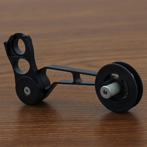 Rear Derailleur Chain Tensioner With 11T Pulley For Folding Bikes, aluminum construction, black finish, close-up view.