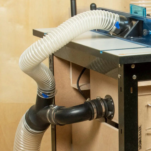 2 And A Half Inch Dust Collection Flex Cuff With Steel Clamps, Rubber Connector Coupler For Woodworking Dust System attached to a workbench