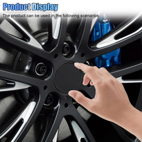 Slick Black Car Wheel Rim Center Caps 4 Pack Heavy Duty Abs Snap In Hub Covers Universal Fit For Cars Trucks And Jeeps 2.13 Inch Outer Diameter, finger touching black wheel cap on alloy wheel.