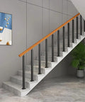 Heavy Duty Black Railing Balusters And Stair Spindles 25 Pack Wrought Iron Look Deck Post Kit in stairway setup.