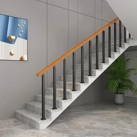 Heavy Duty Black Railing Balusters And Stair Spindles 25 Pack Wrought Iron Look Deck Post Kit in stairway setup.