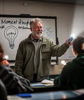 Teacher demonstrating 30 Pack Mini Flashlight Set With Aluminum LED Handheld Torches And Lanyards Assorted Colors in a classroom setting.