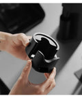 Adjustable Portafilter Holder And Tamping Base For Espresso Machine compatible with 51mm 53mm 58mm filters in black aluminum finish.