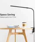 Clip On Desk Lamp LED Reading Light With USB Power Dimmable 3 Color Modes And 10 Brightness Levels Small Clamp Table Light With Flexible Gooseneck For Bed Headboard Home Office Computer Black attached to a desk