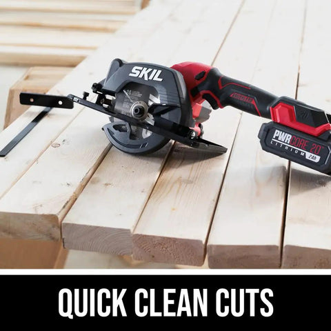 Super Compact One Handed Cordless Circular Saw Kit With Four And A Half Inch Blade Brushless Motor 20V Lithium Battery And Charger on wooden planks.