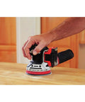 20V Max Cordless 5 Inch Random Orbital Sander Tool Only with Detachable Dust Bag Vacuum Port in use on wood surface