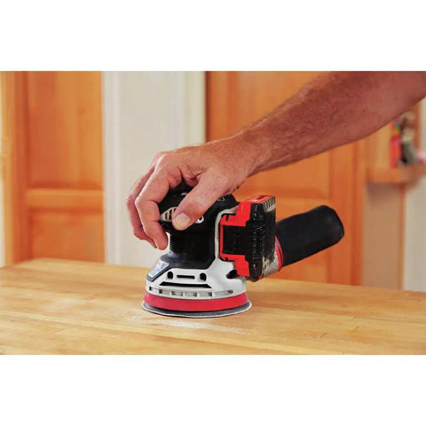 20V Max Cordless 5 Inch Random Orbital Sander Tool Only with Detachable Dust Bag Vacuum Port in use on wood surface