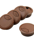 5 Pack Of Sharp Brown Desk Grommets Offering An Easy Peasy Install To Keep Office Cords Neat And Organized A No Sweat High Quality 2 Inch Plastic Cover Set displaying four brown plastic grommets.