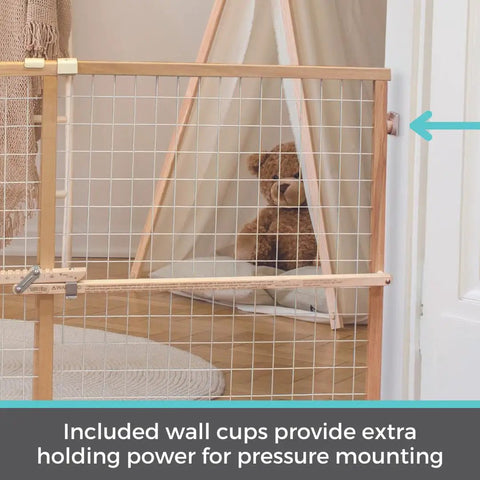 Extra Wide Wooden Baby Gate With Wire Mesh Pressure Mounted for doorways, 29.5 to 50 inches wide, 31 inches tall, shown in use