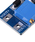 Close-up of Ready To Rock Adjustable DC To DC Step Up Boost Converter showing VOUT connections and components for efficient power supply.