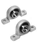 T12 Lead Screw Set 1200mm 47.24 Inch Long 12mm Diameter 2mm Pitch 8mm Lead 4 Starts Includes Brass Nut Coupler And Pillow Bearing Blocks For Vertical Mount No End Machining close-up of two pillow bearing blocks.