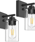 Modern Wall Sconces Set Of Two For Bathroom Vanity Killer Matte Black Finish With Clear Glass Shades, close-up view.