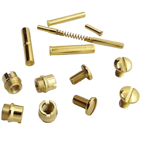 Straight Up Quality Polished Gold Plated 1911 Grip Screws Pins And Bushings Set assorted components in gold finish on white background.