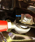 Close-up of red spherical rod end in the Rear Adjustable Toe Rod Kit With Spherical Rod Ends And Red Powder Coat For Chevy Camaro 2016.