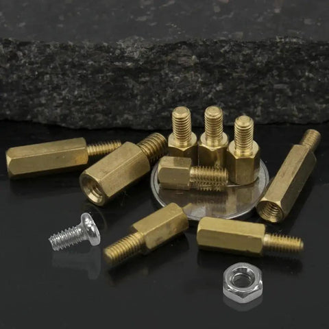 Male Female Brass Hex Standoff Kit For PCB And Motherboard Installations With M2.5 M3 M4 Spacers Nuts And Bolts Quick Install No Sweat Hardware Durable Brass 300 Pieces Ideal For Easy Electronics Assembly, brass standoffs and nuts on black surface