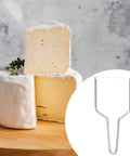 Heavy Duty Stainless Steel Cheese Slicer Wire And Y Type Cutter With Twist Lock next to sliced cheese blocks.