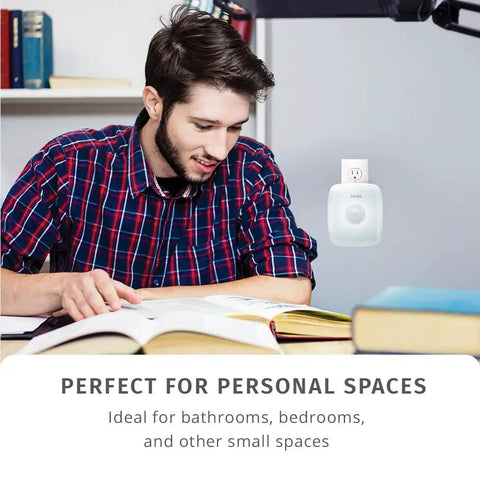 UV-C Plug-In Personal Air Purifier With Auto On Motion Sensor Built-In Night Light in use in small study space