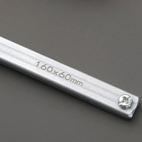 Close-up of Heavy Duty Bench Dog Clamp With PP Handle, showing 160x60mm steel base detail, screw, and metallic finish.