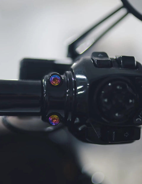 Top Shelf Titanium Handlebar Clamp Bolts And Brake Clutch Perch Screws For Heavy Duty Motorcycles on black handlebars.