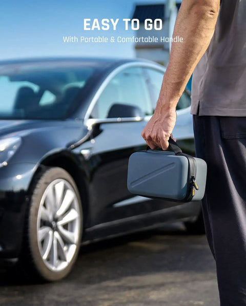 Man holding Officially Customized EVA Storage Case for X8 APEX Tire Inflator and S100 Kit near car