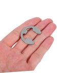 Close-up of a single stainless steel E-type retaining ring for shafts, part of the Stainless Steel External Circlip Assortment Kit E Type Retaining Rings for Shafts Gears and Bearings, Reliable Fastening for Industrial Repair, Heavy Duty Clips and Washers Set for Machinery.