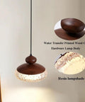 Wood Grain Pendant Light, 3 Color LED Resin Hanging Fixture for Bedroom with textured resin lampshade and walnut grain design.