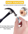 Picture Hanging Kit With 100 Hangers And 120 Nails Holds Up To 30 Lbs Each Easy Install For Wood Or Drywall shown with hammer use
