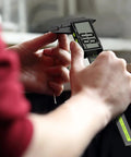 Person using Digital Calipers For Precision Measuring 0 To 6 Inches 150mm With Large LCD Screen on a wooden surface