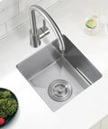 Top view of Heavy Duty 16 Gauge Stainless Steel Undermount Bar Sink 13 Inch By 15 Inch Exterior with faucet in modern kitchen setup