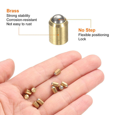 Top Shelf 10 Pack Solid Brass Ball Spring Plungers Sized 4X5mm on hand, showcasing brass material and flexible lock design.