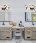 Retro Vintage Four Light Wall Lamp For Bathroom Vanity With Amber Glow Glass Shade Scroll Arm Design In Golden Bronze Finish With Silver Accents Providing Dope Warm Ambient Glow And Classic Elegant Lighting in modern bathroom setting.