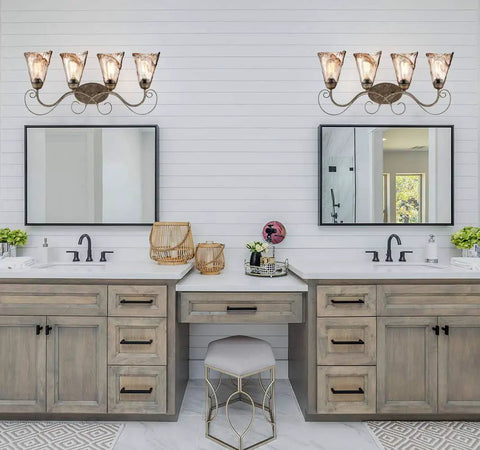 Retro Vintage Four Light Wall Lamp For Bathroom Vanity With Amber Glow Glass Shade Scroll Arm Design In Golden Bronze Finish With Silver Accents Providing Dope Warm Ambient Glow And Classic Elegant Lighting in modern bathroom setting.