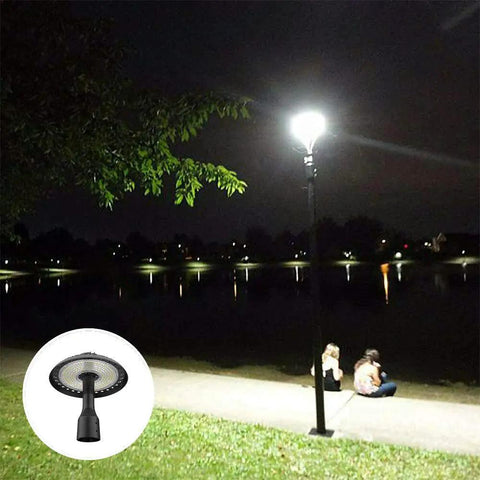 Outdoor Post Top LED Light 100W Area Light, 13,000 Lumens, 5500K Pure White installed by a riverside pathway at night.