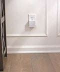 No Fuss Setup Smart WiFi Adapter For Sense Deadbolt, 2.4GHz Only, White Finish plugged into wall outlet in home setting