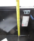 Interior view of black 20x16x10 Industrial Control Panel Enclosure NEMA 4 and 12, showing depth measurement with tape measure inside.