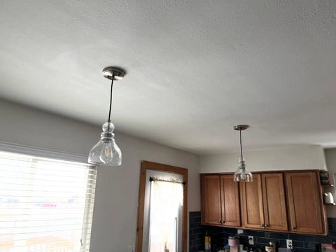Two Pack Pendant Lights With 6.5 Inch Hand Blown Seeded Glass And Brushed Nickel Finish above kitchen island