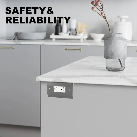 Under Cabinet Hidden Outlet Box With Slim Stainless Steel Build And Powder Coat Finish A Hassle Free Space Saving Electrical Solution For Kitchen Garage Or Workshop Low Profile And Rust Resistant Easy Install Under Counter Power Outlet installed under a kitchen counter.
