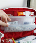 PenyaZo red first aid bag opened to reveal clear inner pouches and medical supplies