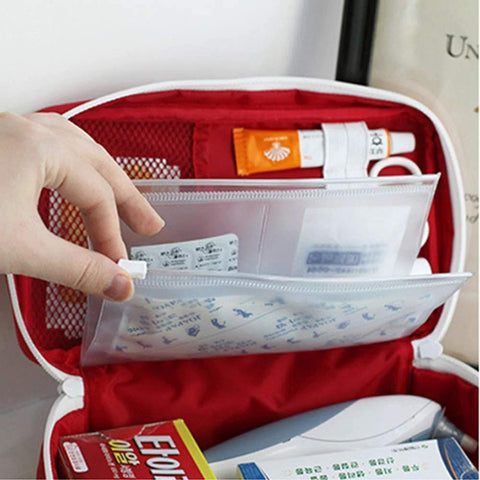 PenyaZo red first aid bag opened to reveal clear inner pouches and medical supplies