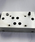 Part 013403-1 Manifold For 60K Waterjet Intensifier Replacement Kit, metal block with threaded connectors, front view