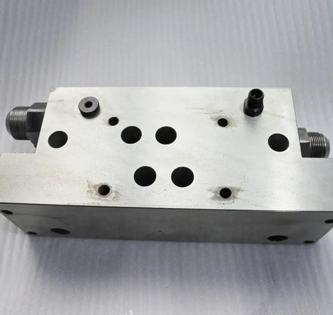 Part 013403-1 Manifold For 60K Waterjet Intensifier Replacement Kit, metal block with threaded connectors, front view